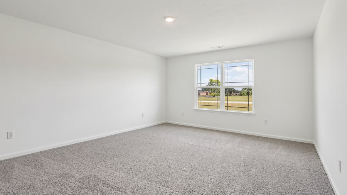 primary bedroom with large windows