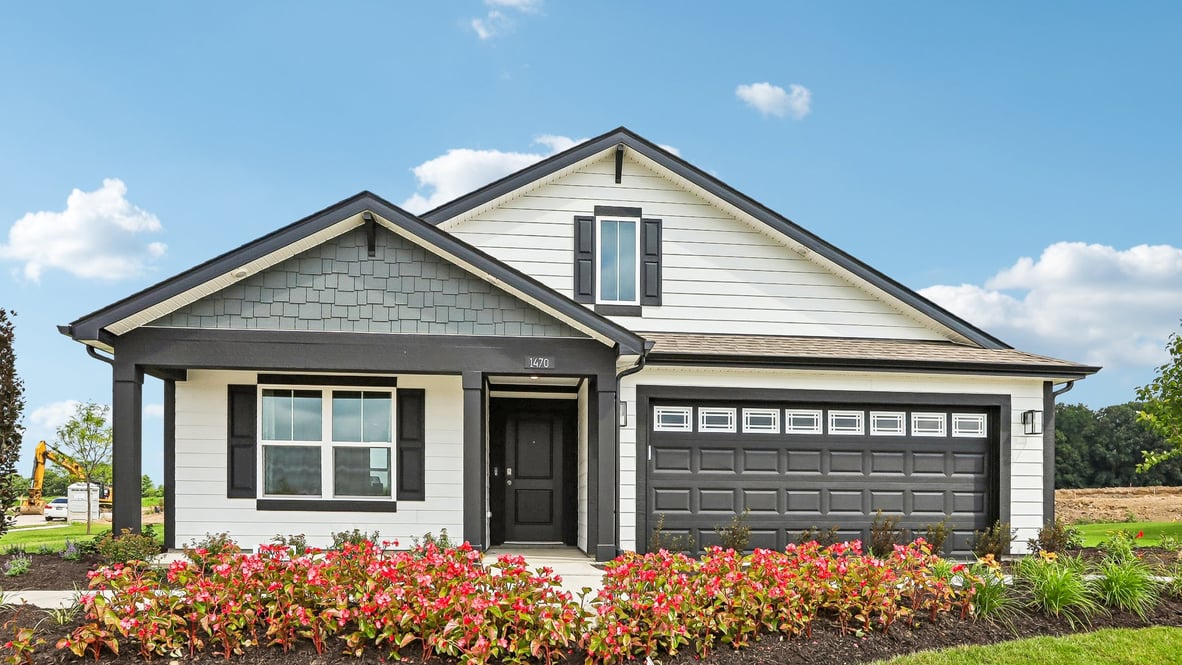 beautiful white ranch home with beautiful landscaping