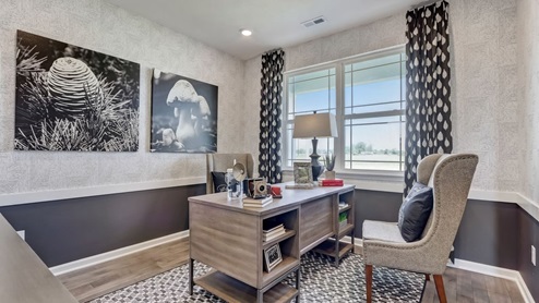 home office with desk and wainscoting paint detail