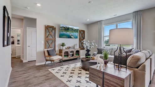 great room with area rug and neutral color scheme