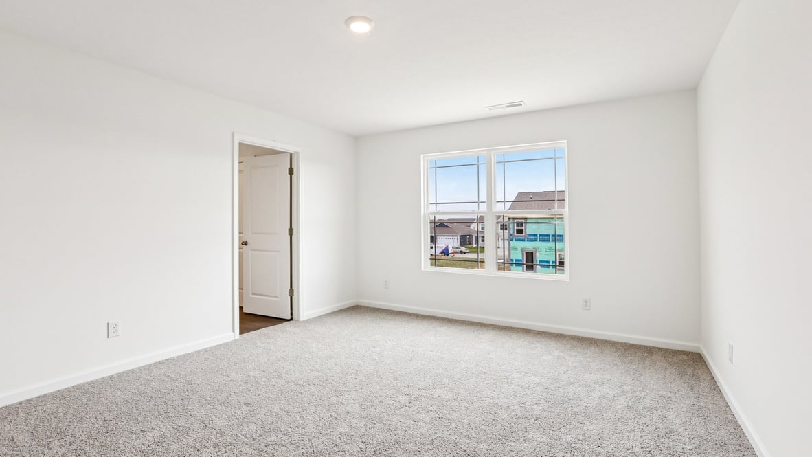primary bedroom with large windows
