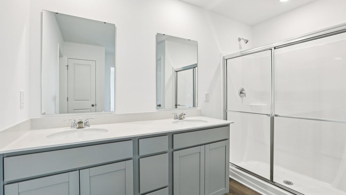 primary bathroom with dual vanity