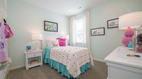 girls bedroom with pink accents