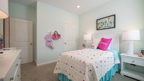 girls bedroom with pink accents