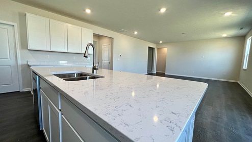 kitchen with island and quartz countertops