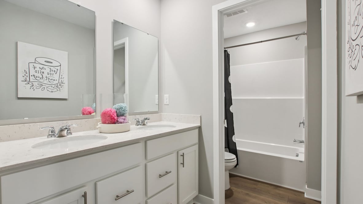 bathroom with dual vanity