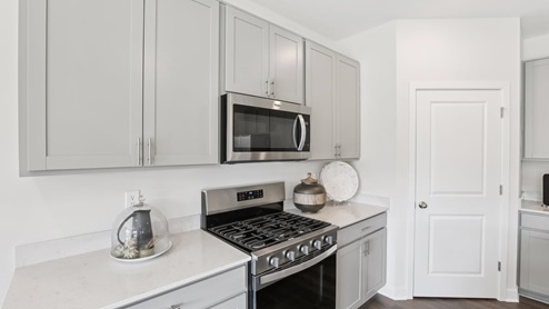 kitchen with large corner pantry