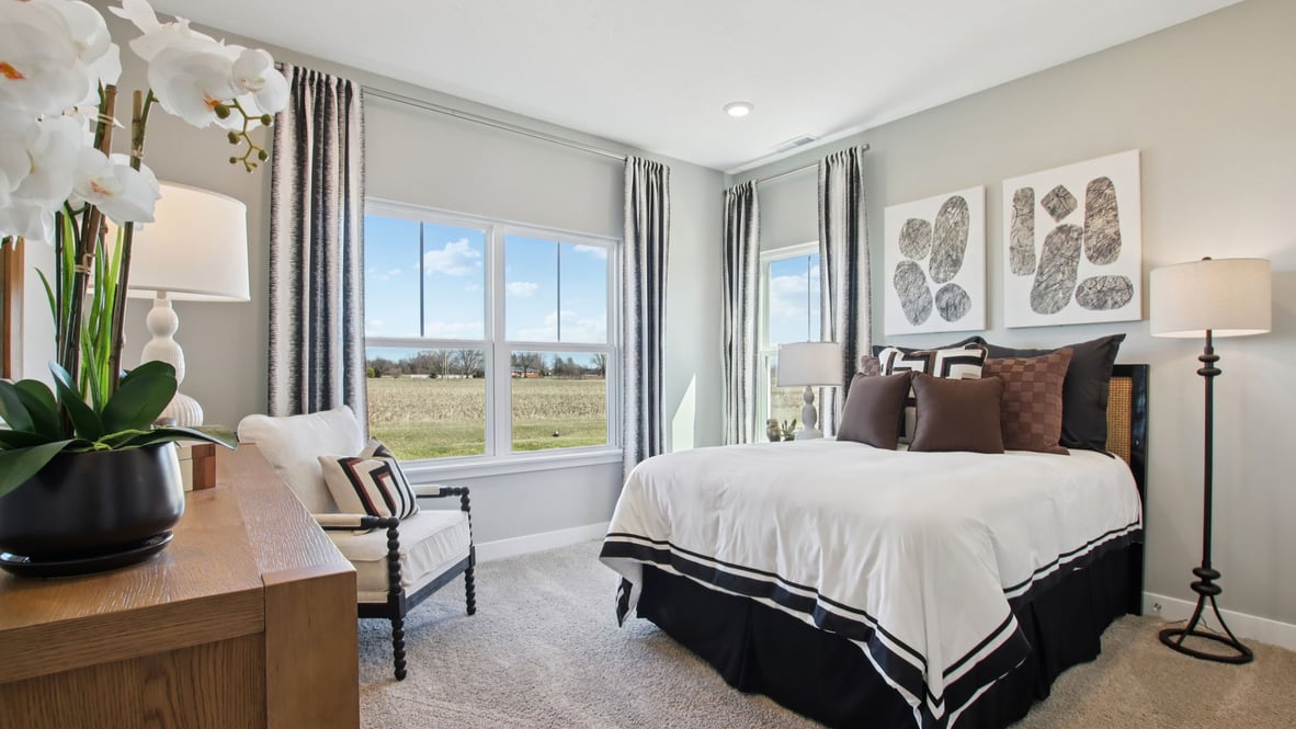 guest bedroom with large windows