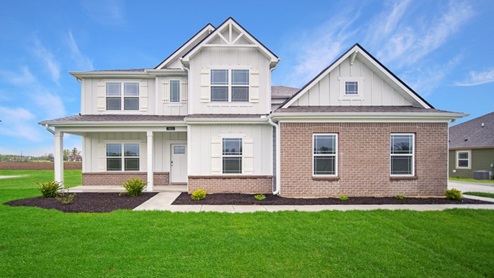 two story farmhouse home with side load garage