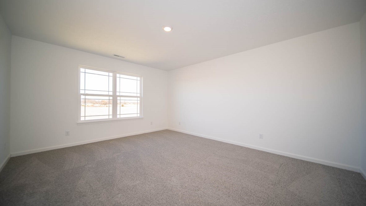 primary bedroom with large windows