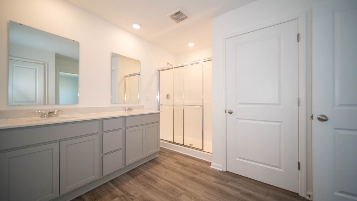 primary bathroom with dual vanity