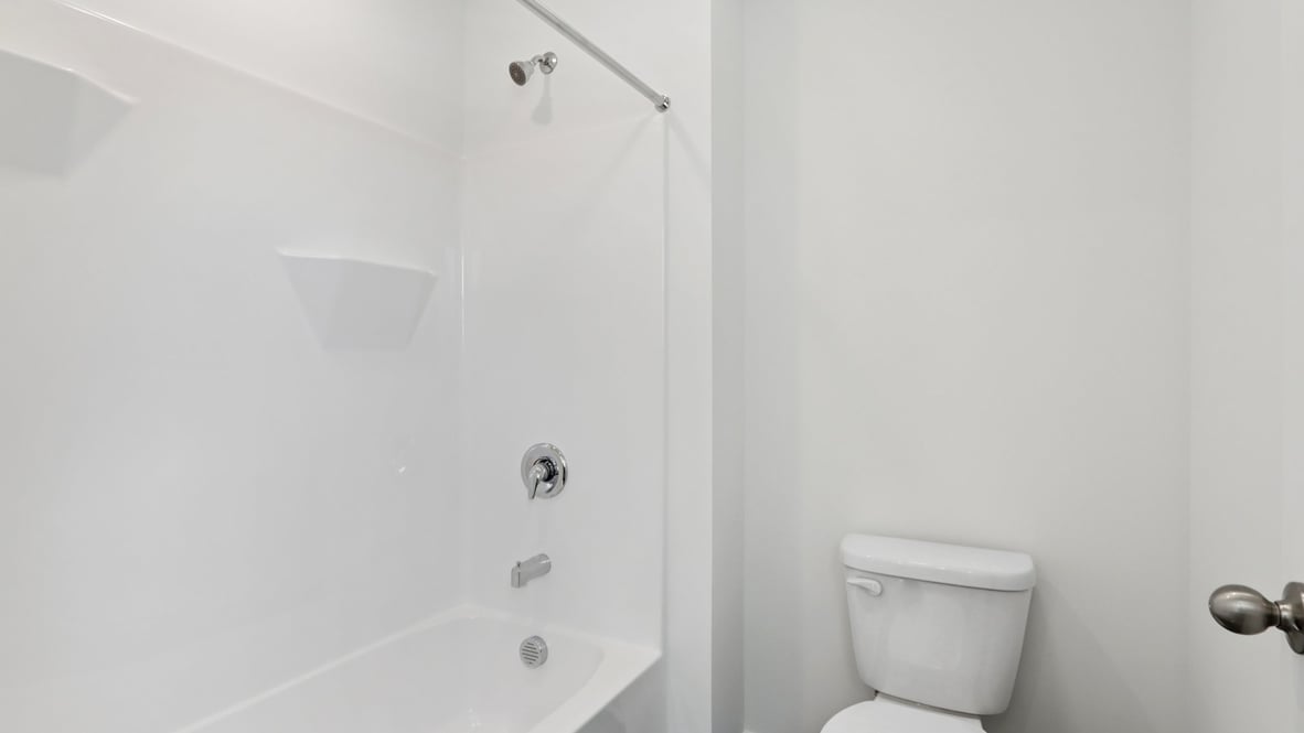 toilet next to the shower