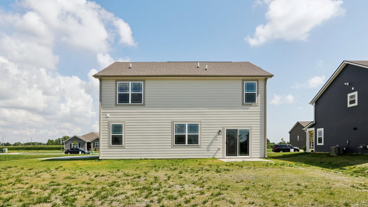 rear exterior of home featuring a concrete patio