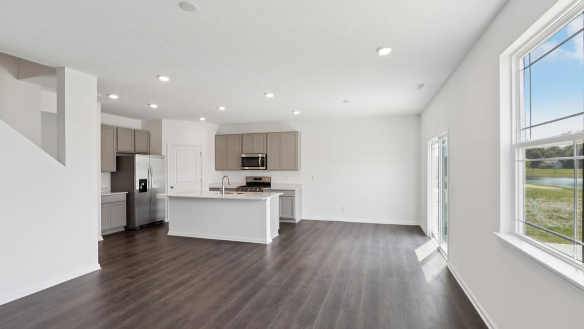 Open concept first floor with the living room, dining room and kitchen next to each other