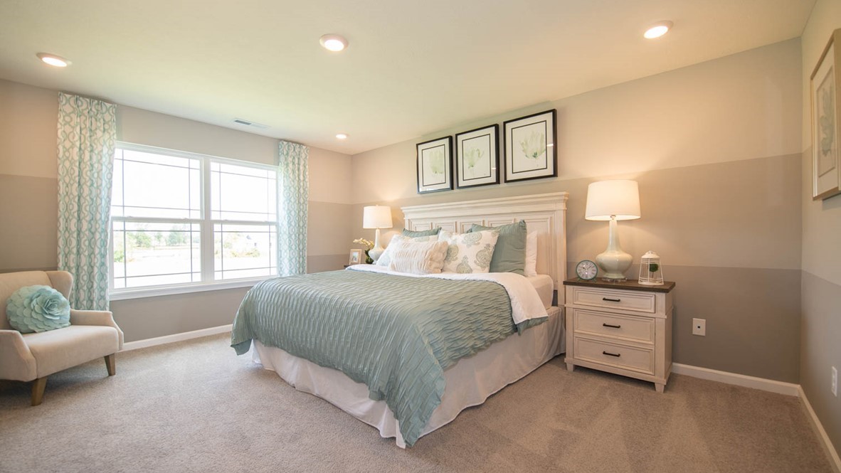 primary bedroom with large windows