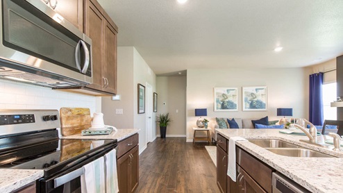 Enjoy entertaining in the spacious kitchen with a large built-in island and beautiful cabinets