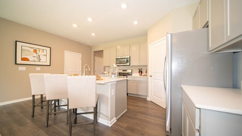 kitchen with large corner pantry