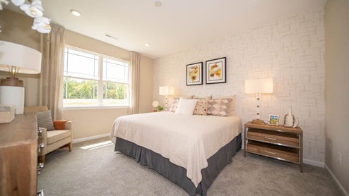 primary bedroom with large windows