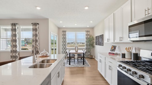 white cabinetry and quartz countertops in Fairfax plan