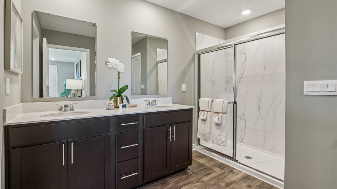 primary bathroom with dual vanity