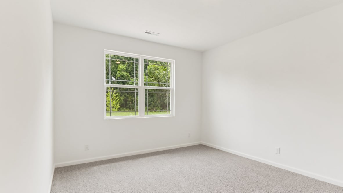 primary bedroom with large windows
