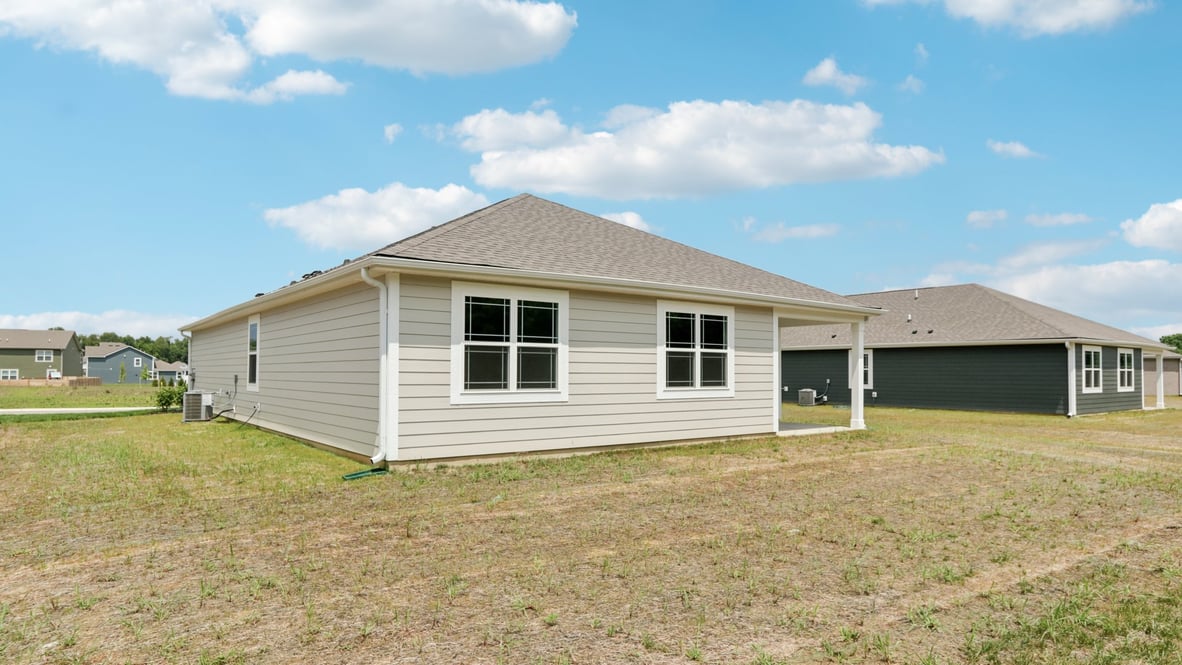 covered patio on the back of the home