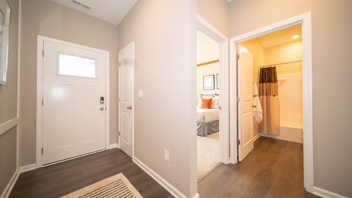 Interior entry hall area with vinyl wood flooring.