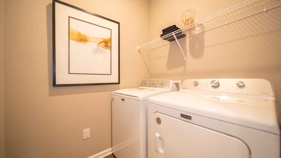 Laundry room with wire shelf.