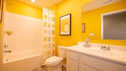 A lovely Hall bath is easily accessible from the bedrooms