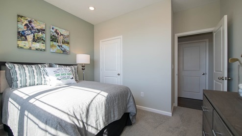 The guest bedroom offers easy access to the great room and kitchen.