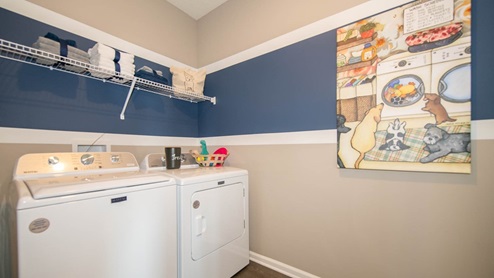 The laundry room is readily accessible from all the main living areas.