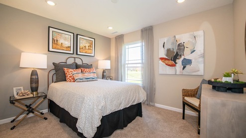 guest bedroom with large windows