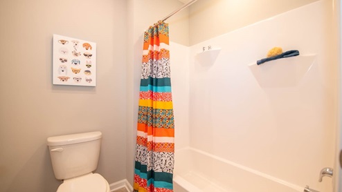 bathroom with shower and tub combo