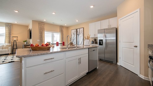 Enjoy entertaining in the spacious kitchen with a large built-in island and beautiful cabinetry.