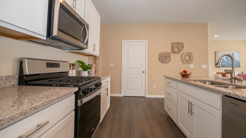 Enjoy entertaining in the spacious kitchen with a large built-in island and beautiful cabinetry.