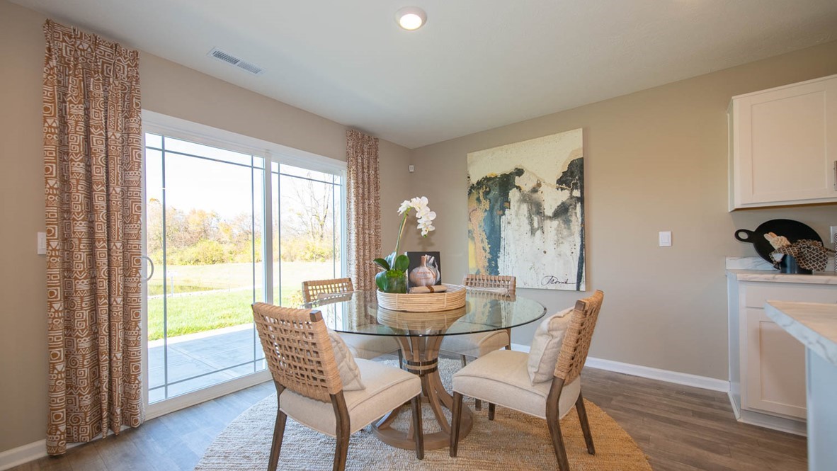 The kitchen offers beautiful cabinetry, a large pantry and a built-in island with ample seating space.