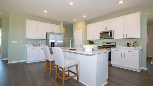 kitchen with center island white cabinets