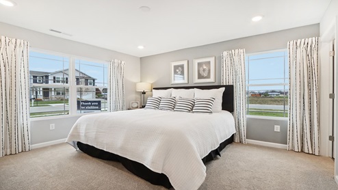 primary bedroom with large windows