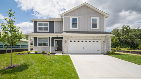 two story home with extended garage