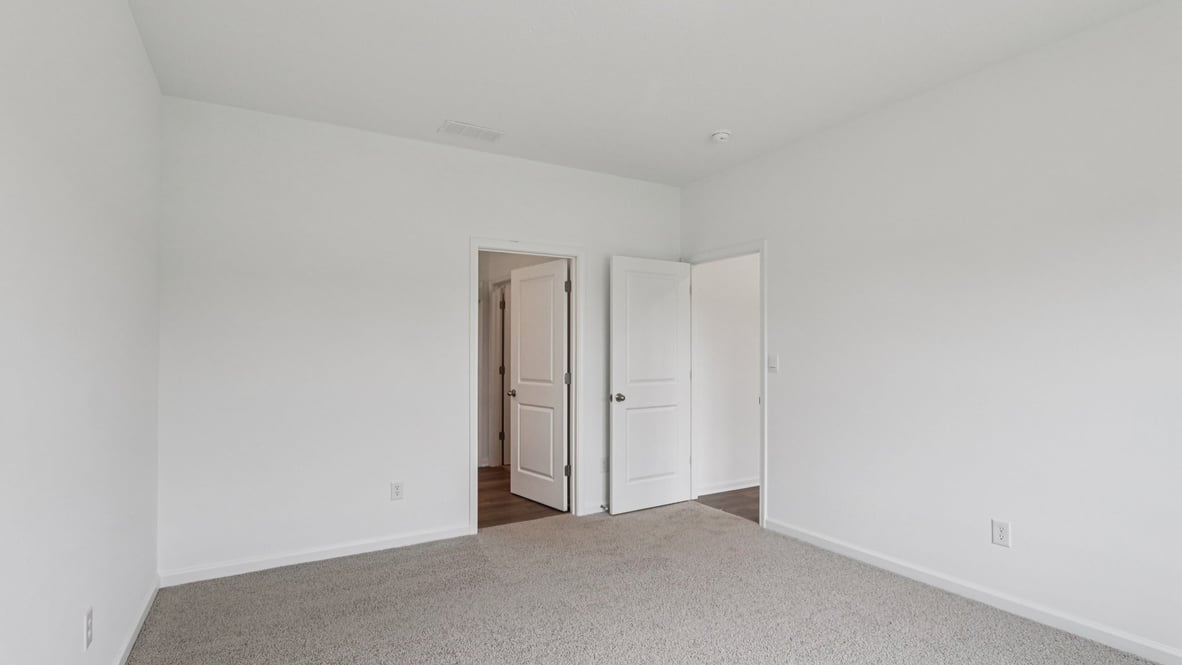 Primary bedroom designed with privacy and comfort in mind, flowing into the spa-inspired ensuite and walk-in closet Parkview Village