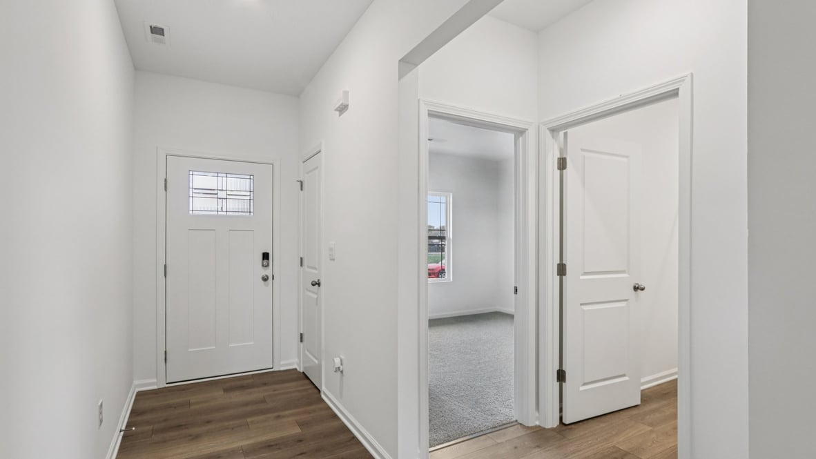 Front entry near bedroom 2, full bath, garage access