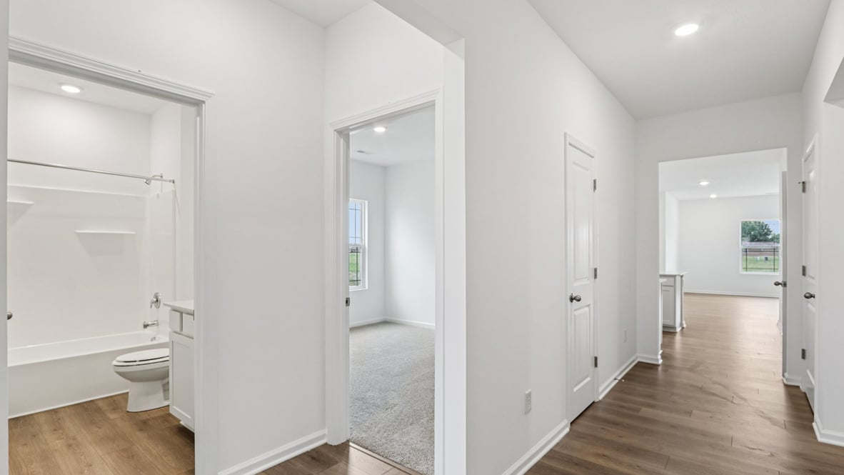 Front entry view showing access to bedroom 2, full bathroom, and garage Parkview Village