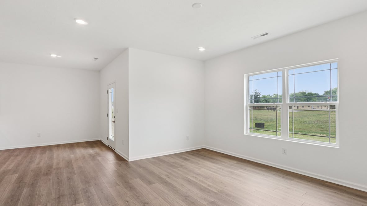 Entry view toward the residence highlighting the utility room and bedroom 3 access