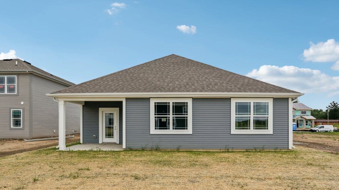 rear exterior of home featuring a covered concrete patio