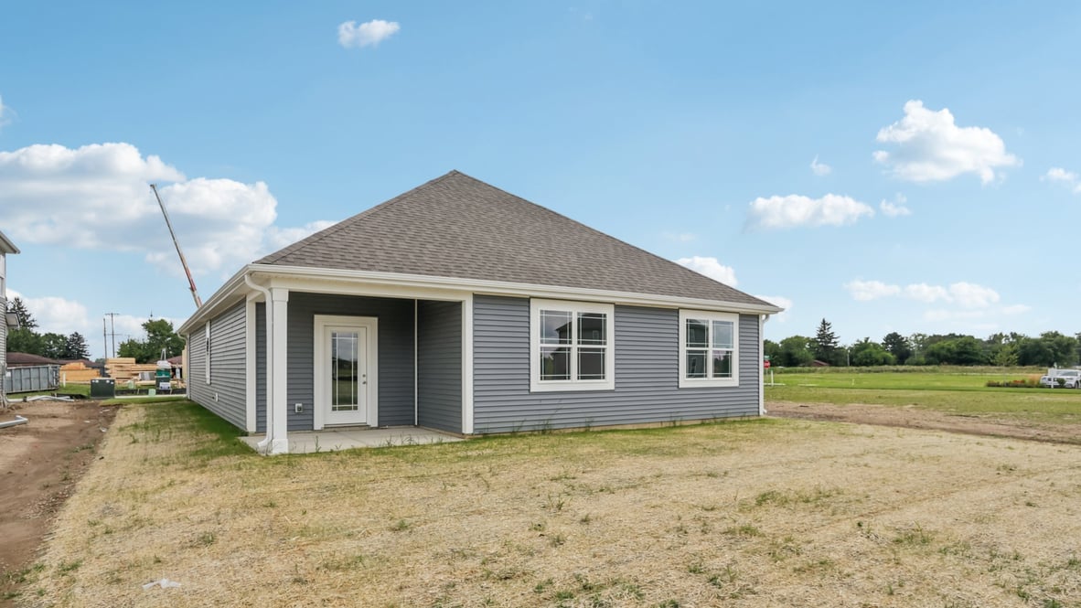 rear exterior of home featuring a covered concrete patio