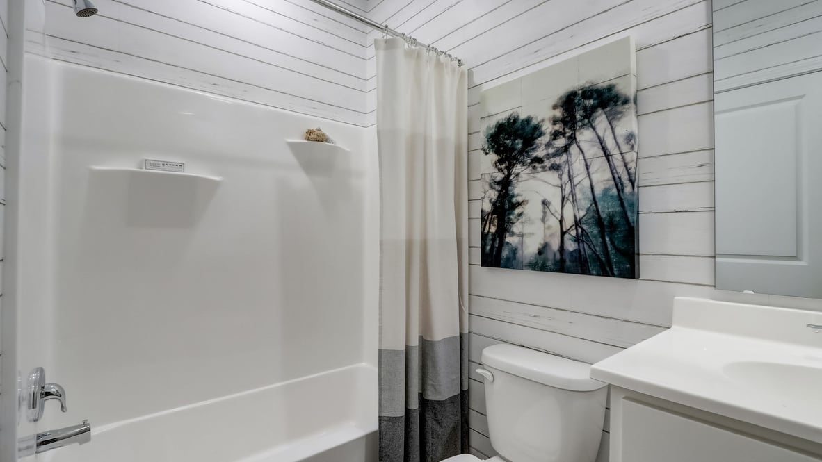 guest bathroom with shower and tub