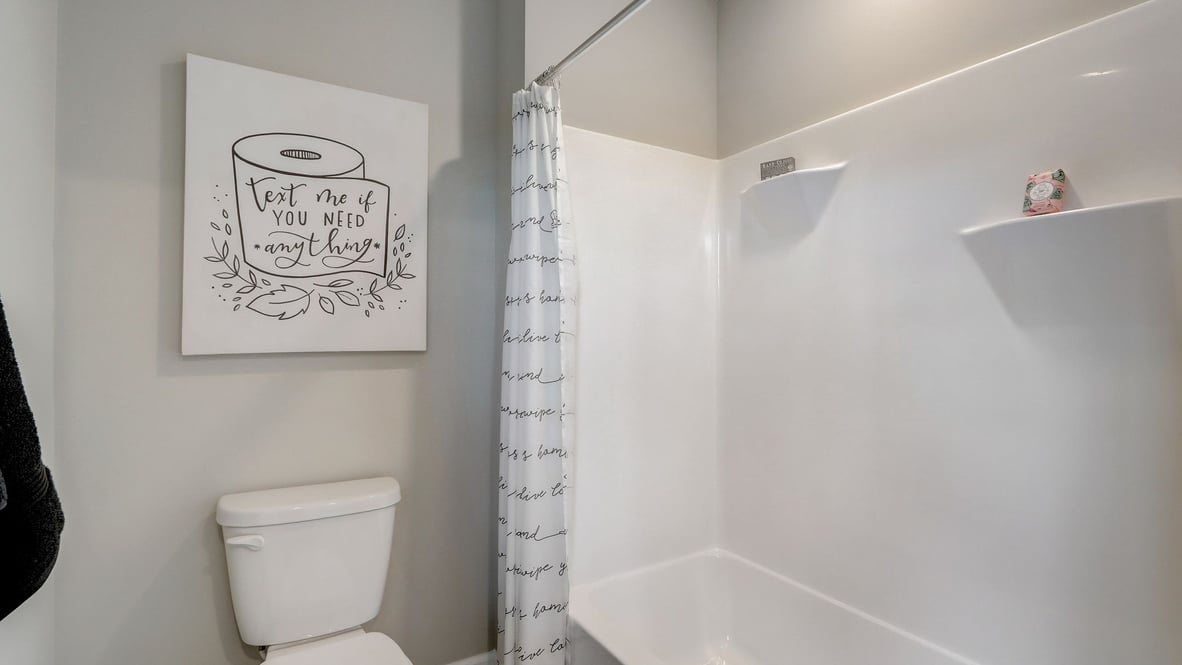bathroom with shower and tub