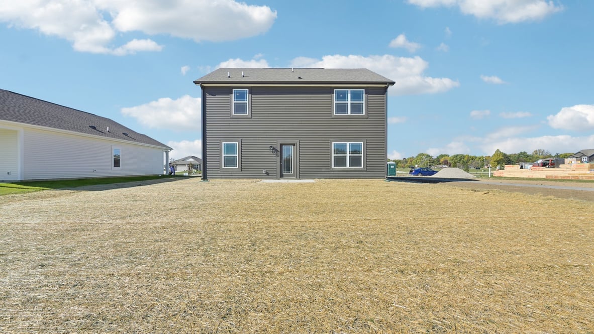 rear of home and spacious backyard