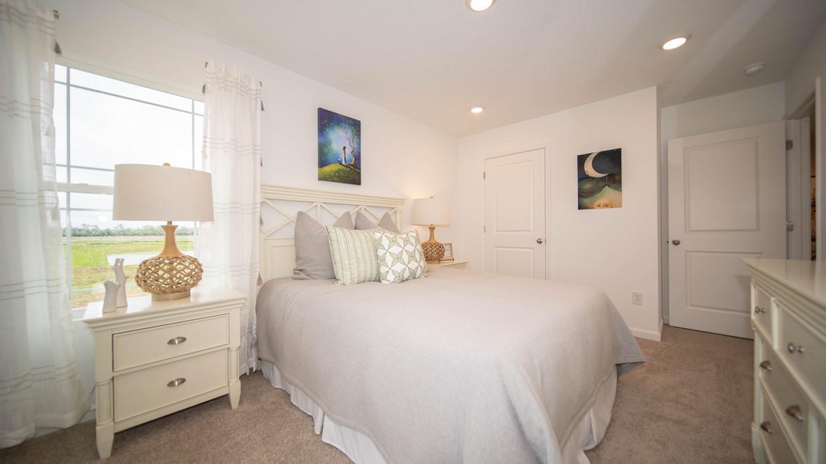 bedroom 2 with twin bed, nightstand and dresser