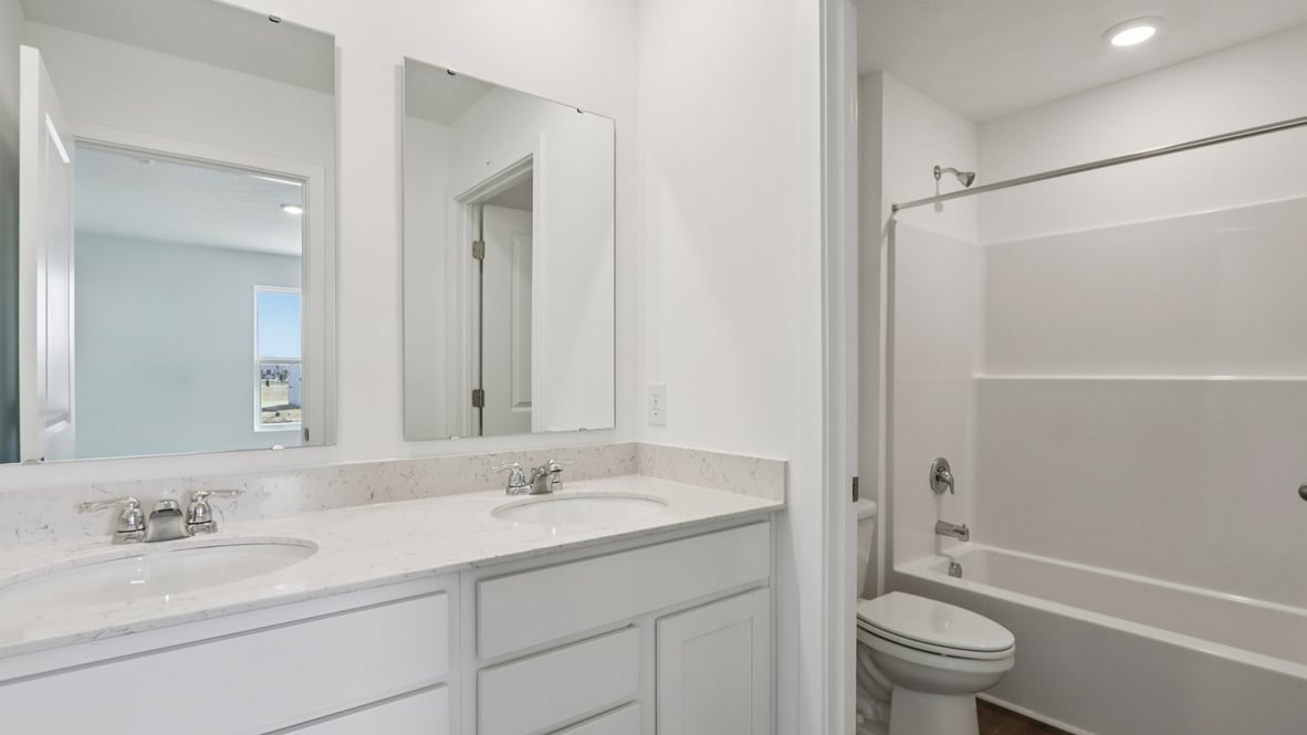 bathroom with dual vanity